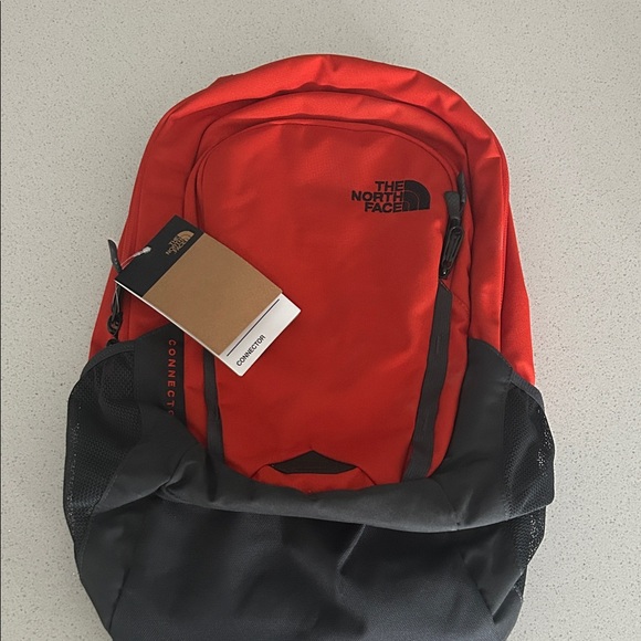The North Face orange and Black Backpack brand new with tags